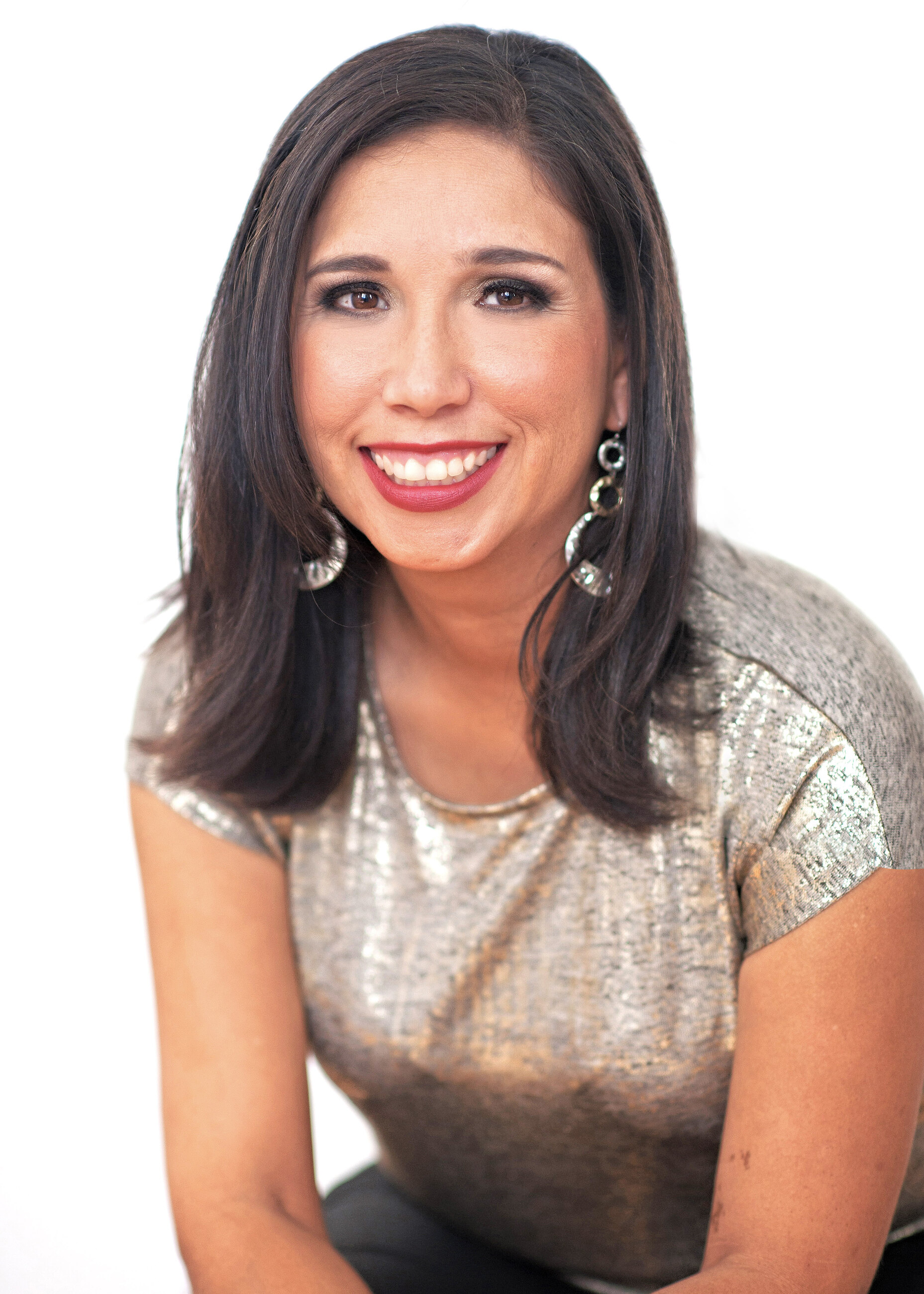 Campaign portrait of Lita Leo wearing a shimmering metallic top